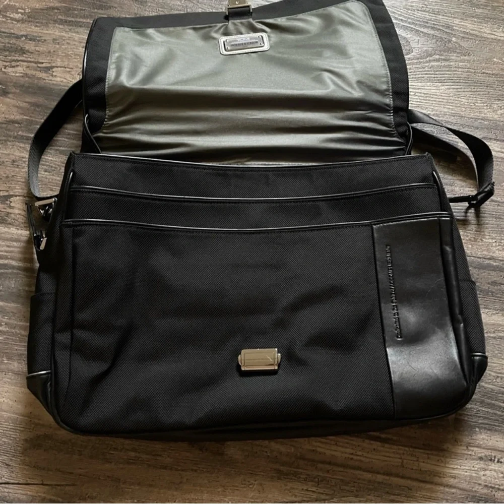 TUMI BRIEFCASE LAPTOP BAG  (zippers in back to attach  suitcase handles)